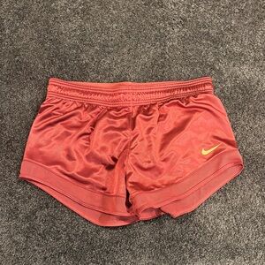Nike Women's Athletic Shorts in Red with Yellow Logo